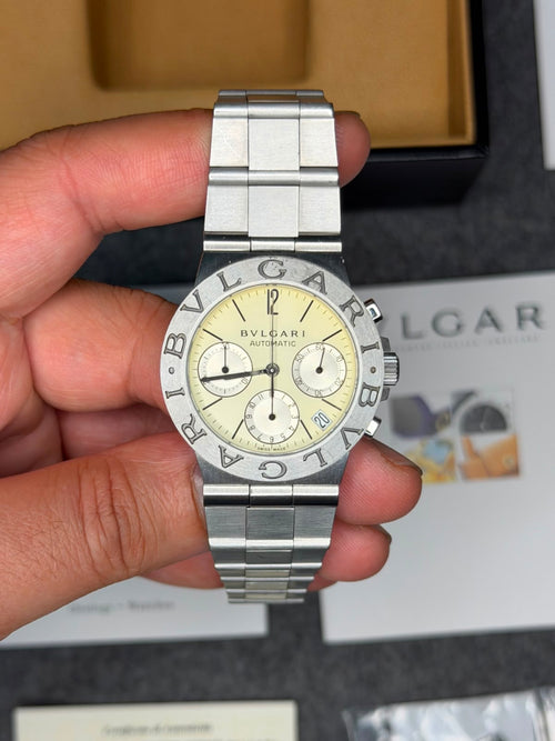 Bvlgari Diagono CH 35 S automatic chronograph with ivory dial, held in hand with its box and papers